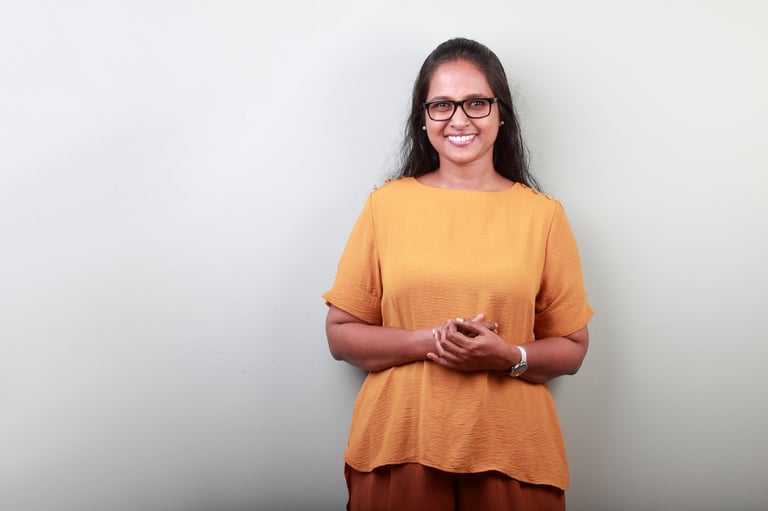 Portrait of a woman of Indian ethnicity with a smiling face
