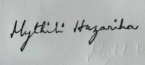 Handwritten text reading Mythical Hazartha on a white surface