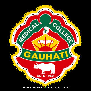 Gauhati Medical College logo featuring a red shield with green curved section, medical caduceus symbol, yellow crown and rhino, established 1960